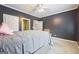 Bedroom featuring gray walls, carpet, and a view to the exterior at 25 Abelia Dr, Covington, GA 30014