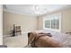 Tan bedroom showcasing carpet, ceiling fan and bright window at 25 Abelia Dr, Covington, GA 30014