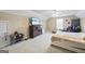 Bedroom with beige carpet, ceiling fan, and a large dresser with a TV at 25 Abelia Dr, Covington, GA 30014