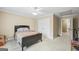 Neutral bedroom with carpet, ceiling fan and double door closet at 25 Abelia Dr, Covington, GA 30014