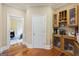 Butler's pantry with wooden cabinets and storage space at 25 Abelia Dr, Covington, GA 30014