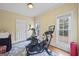 Bright home gym featuring ample light and exercise equipment at 25 Abelia Dr, Covington, GA 30014