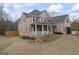 Brick home with attached garage and front porch, set on a spacious lot at 25 Abelia Dr, Covington, GA 30014