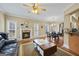 Inviting living room with a cozy fireplace and natural light at 25 Abelia Dr, Covington, GA 30014