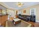 Open-concept living room featuring hardwood floors and large windows at 25 Abelia Dr, Covington, GA 30014