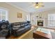 Comfortable living room with fireplace and large windows at 25 Abelia Dr, Covington, GA 30014