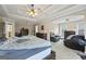 Spacious main bedroom with carpet, tray ceiling, and natural light at 25 Abelia Dr, Covington, GA 30014