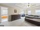 Spacious main bedroom featuring tray ceiling, carpeted floor, and an ensuite at 25 Abelia Dr, Covington, GA 30014