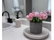 Stylish bathroom vanity decorated with tulips, adding a touch of elegance and freshness at 110 Cloverwood Dr, Fayetteville, GA 30215