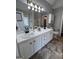 Spacious bathroom featuring double sinks, ample counter space, and stylish fixtures at 110 Cloverwood Dr, Fayetteville, GA 30215