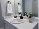 Bathroom with white vanity, black fixtures, and decorative touches create a serene atmosphere at 110 Cloverwood Dr, Fayetteville, GA 30215