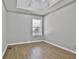 Bright bedroom features neutral walls, modern fan, updated lighting, and wood-look floors at 110 Cloverwood Dr, Fayetteville, GA 30215