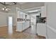 The kitchen features white cabinets, brick backsplash and stainless steel appliances at 110 Cloverwood Dr, Fayetteville, GA 30215