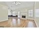 Living room with hardwood floors, fireplace, and vaulted ceiling at 110 Cloverwood Dr, Fayetteville, GA 30215