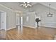 Open floor plan showing the living room with wood floors and the adjacent kitchen at 110 Cloverwood Dr, Fayetteville, GA 30215