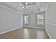 Expansive main bedroom featuring tray ceilings and large windows, providing plenty of natural light at 110 Cloverwood Dr, Fayetteville, GA 30215
