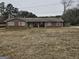 Ranch style brick home with a large front yard at 4881 Highway 155 N, Stockbridge, GA 30281