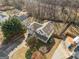 An aerial view of a home with a charming porch, a boat in the driveway, and an expansive yard at 232 Taylors Farm Dr, Canton, GA 30115