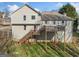 Back exterior showcasing a two-story home with a spacious wooden deck and a well-maintained lawn at 232 Taylors Farm Dr, Canton, GA 30115