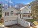 Classic home featuring a two-car garage, front porch, and driveway at 232 Taylors Farm Dr, Canton, GA 30115