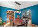 Open-concept living space with a dining room boasting hardwood floors and seamlessly connected to the kitchen at 232 Taylors Farm Dr, Canton, GA 30115