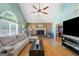 Bright living room with vaulted ceilings, hardwood floors, fireplace, and plenty of natural light at 232 Taylors Farm Dr, Canton, GA 30115