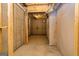 Unfinished basement with exposed utilities and concrete flooring at 69 Oakhurst Trl, Sharpsburg, GA 30277