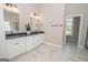 Double vanity bathroom with granite countertops and walk-in closet at 69 Oakhurst Trl, Sharpsburg, GA 30277