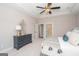 Bedroom with a dresser and a view of the bathroom at 69 Oakhurst Trl, Sharpsburg, GA 30277