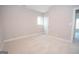 Bright bedroom with neutral walls and carpet at 69 Oakhurst Trl, Sharpsburg, GA 30277