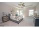 Spacious bedroom with ceiling fan, large windows and carpeted floors at 69 Oakhurst Trl, Sharpsburg, GA 30277