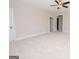 Spacious bonus room with neutral carpeting and ceiling fan at 69 Oakhurst Trl, Sharpsburg, GA 30277