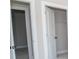 Two closets with white doors and neutral walls at 69 Oakhurst Trl, Sharpsburg, GA 30277