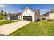 View of the home's garage and driveway at 69 Oakhurst Trl, Sharpsburg, GA 30277
