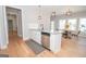 Modern kitchen with white cabinets, granite counters, and stainless steel appliances at 69 Oakhurst Trl, Sharpsburg, GA 30277