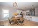 Modern kitchen with white cabinets, granite counters, and stylish lighting at 69 Oakhurst Trl, Sharpsburg, GA 30277