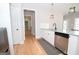 Modern kitchen with white cabinets, granite countertops, and stainless steel appliances at 69 Oakhurst Trl, Sharpsburg, GA 30277