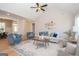 Spacious living room boasts vaulted ceilings, comfy seating, and a stylish rug at 69 Oakhurst Trl, Sharpsburg, GA 30277