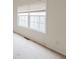 Bedroom with large window and neutral wall colors at 504 Serene Waters Trl, Jonesboro, GA 30236