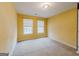 Well-lit bedroom with two windows and neutral colored walls at 504 Serene Waters Trl, Jonesboro, GA 30236