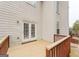Wooden deck with railing, leading to backyard at 504 Serene Waters Trl, Jonesboro, GA 30236