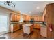 Kitchen with island, hardwood floors, and ample cabinetry at 504 Serene Waters Trl, Jonesboro, GA 30236