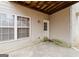 Small covered patio with access from the back of the house at 504 Serene Waters Trl, Jonesboro, GA 30236
