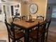 Dining room features hardwood floors, modern chandelier and adjacent kitchen view at 3025 Sumit Wood Nw Dr, Kennesaw, GA 30152