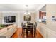 Bright dining area with hardwood floors and kitchen views at 4701 Wehunt Se Trl, Smyrna, GA 30082