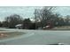 Home and red outbuilding on corner lot near road at 1597 Highway 92 S, Fayetteville, GA 30215