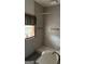 Bathroom with shower,grab bars, and vinyl flooring at 1597 Highway 92 S, Fayetteville, GA 30215