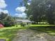 Charming home with a spacious yard, a serene setting, and a detached garage at 1597 Highway 92 S, Fayetteville, GA 30215