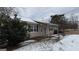 Ranch home with covered porch and snow-covered yard at 1597 Highway 92 S, Fayetteville, GA 30215