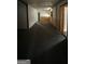 Living room with carpeted floors and wood paneling at 1597 Highway 92 S, Fayetteville, GA 30215